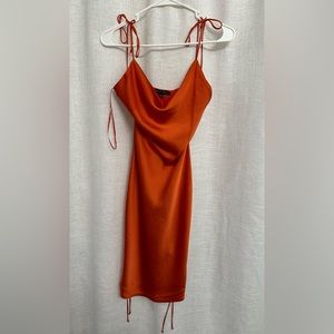Satin midi orange dress, adjustable straps on the shoulder